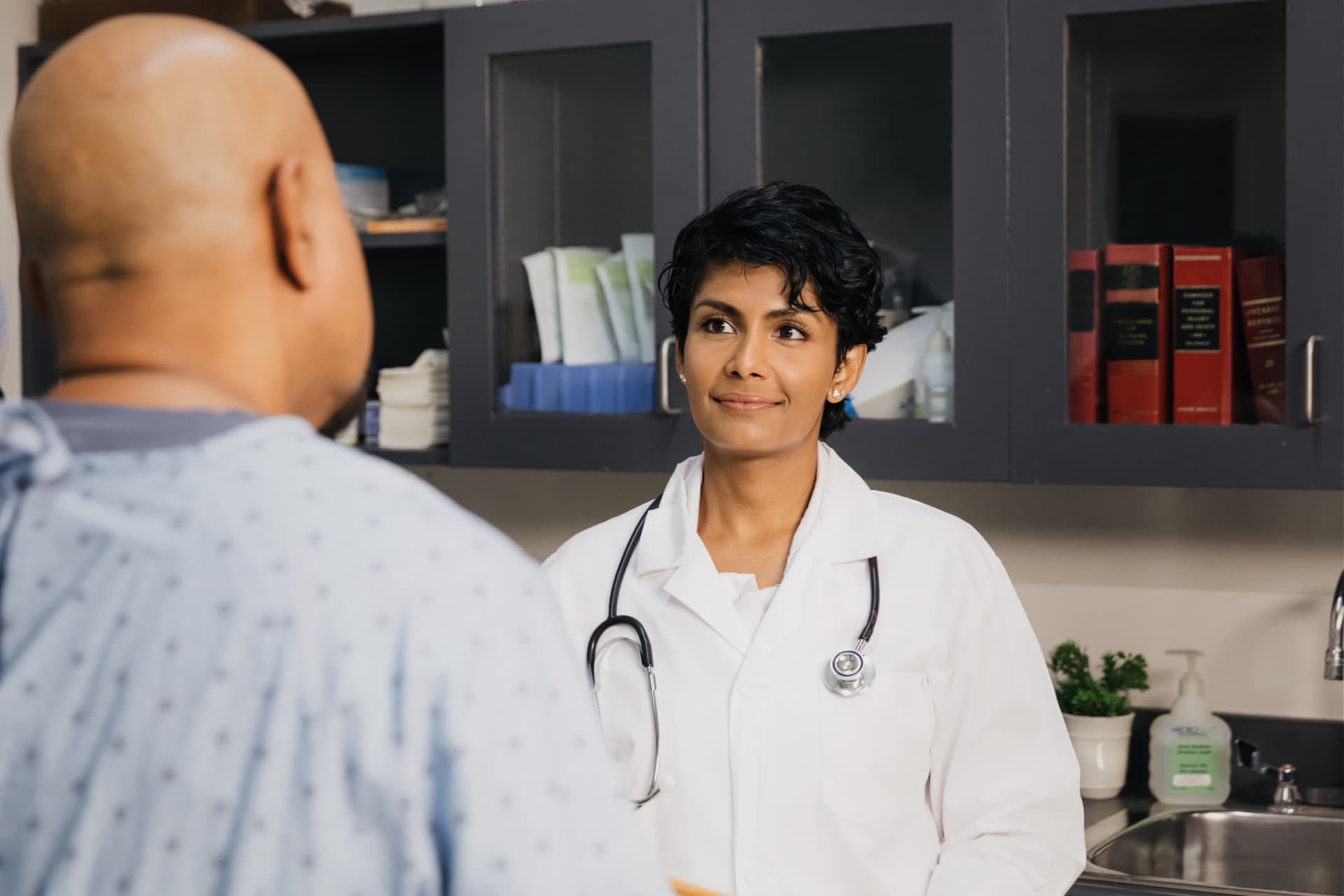 A doctor speaking with a patient